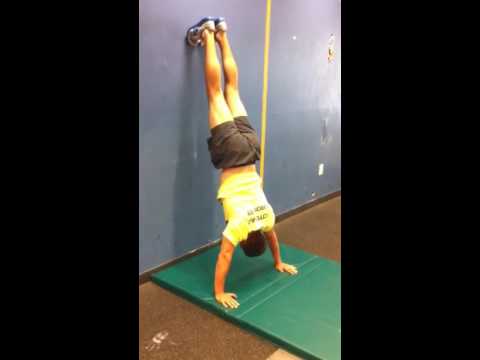 Headstand Push-Up Negative (Wall-Supported)